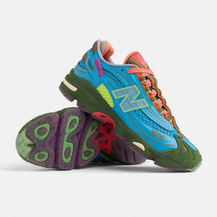 A pair of colorful New Balance x Salehe 1000 shoes on a grey background. 